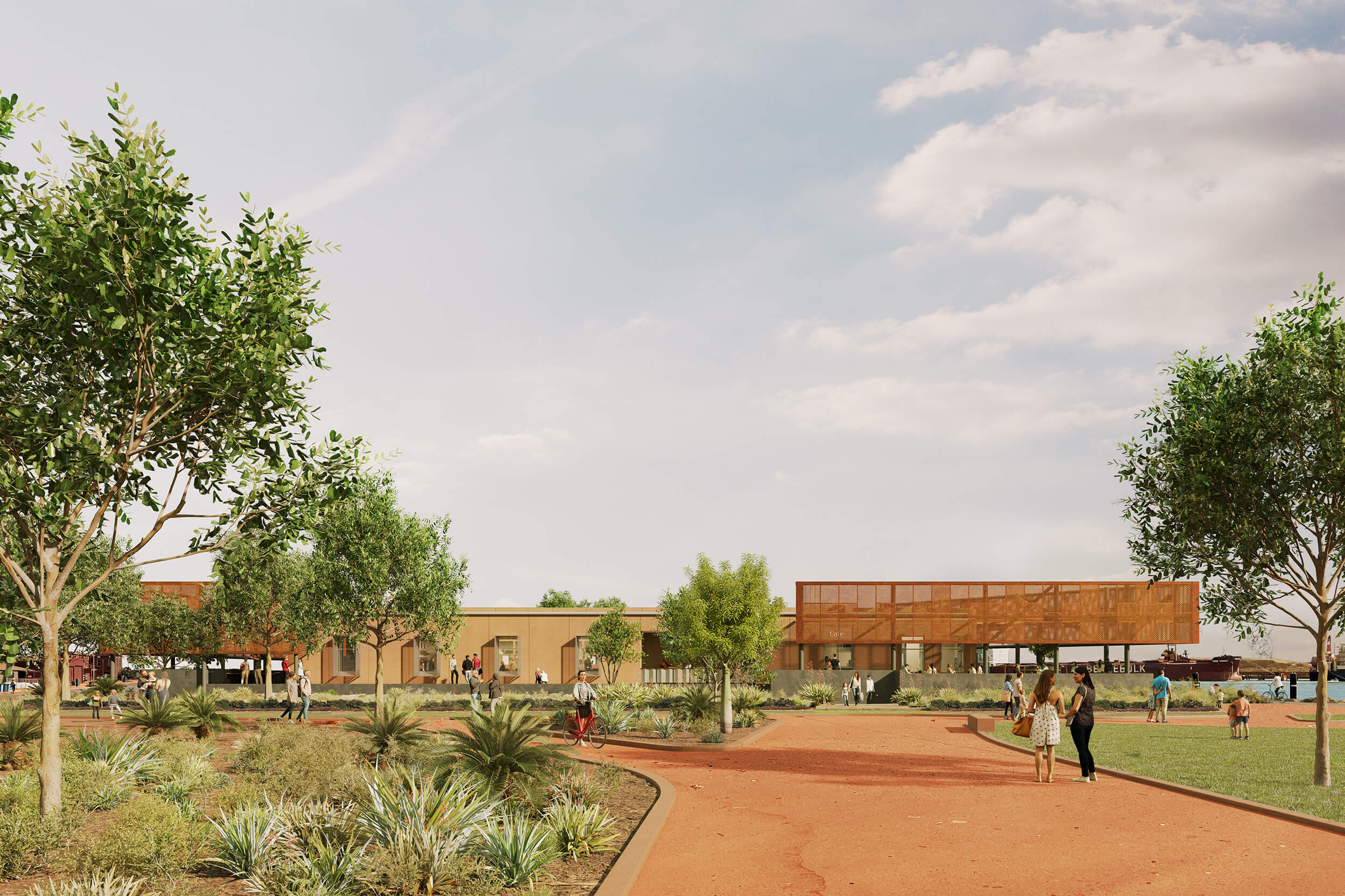 Park area with trees and plants, walking paths, and people near a modern building by the waterfront.